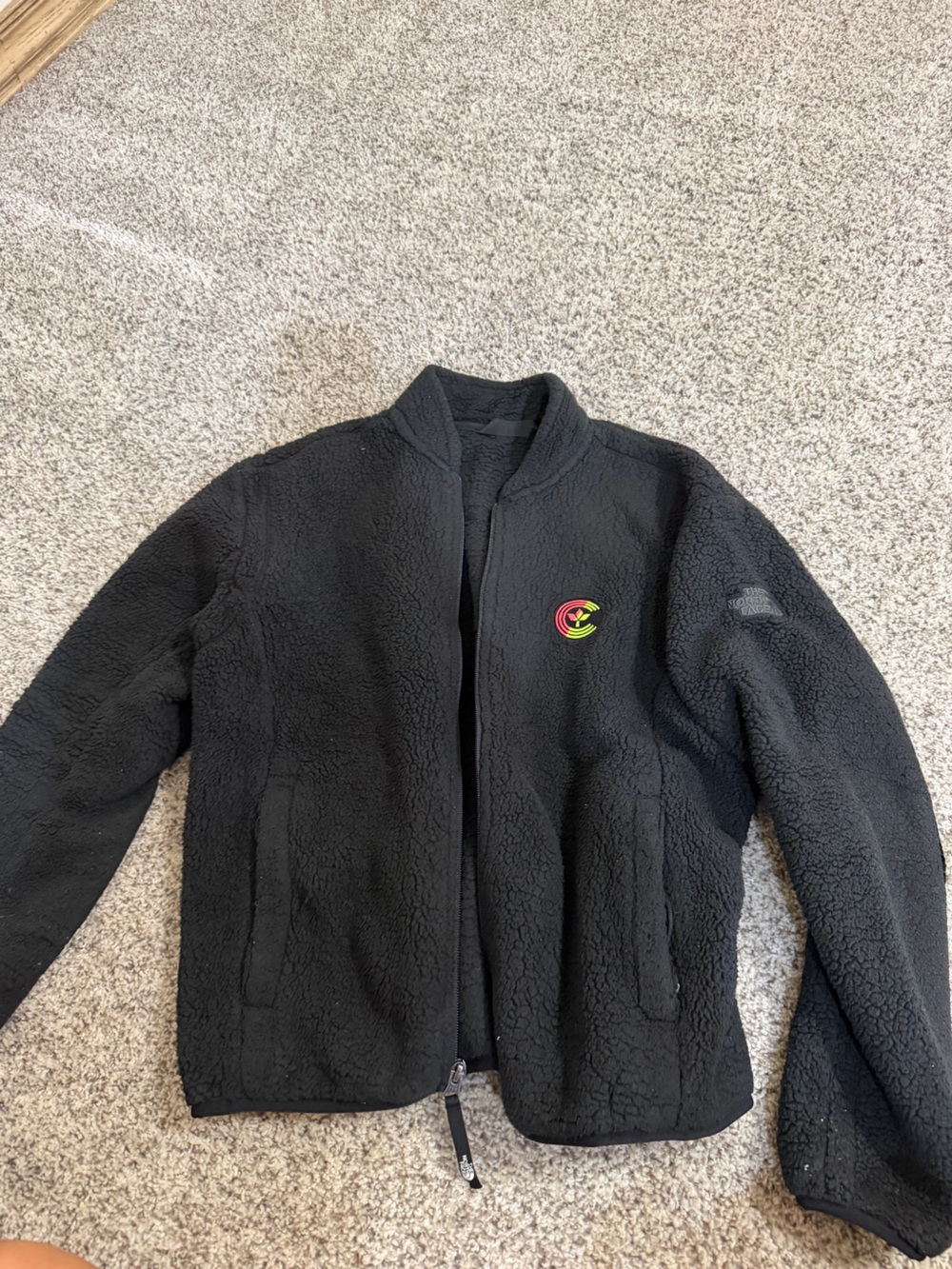 The North Face Black Sherpa Fleece Jacket with Colorful Patch